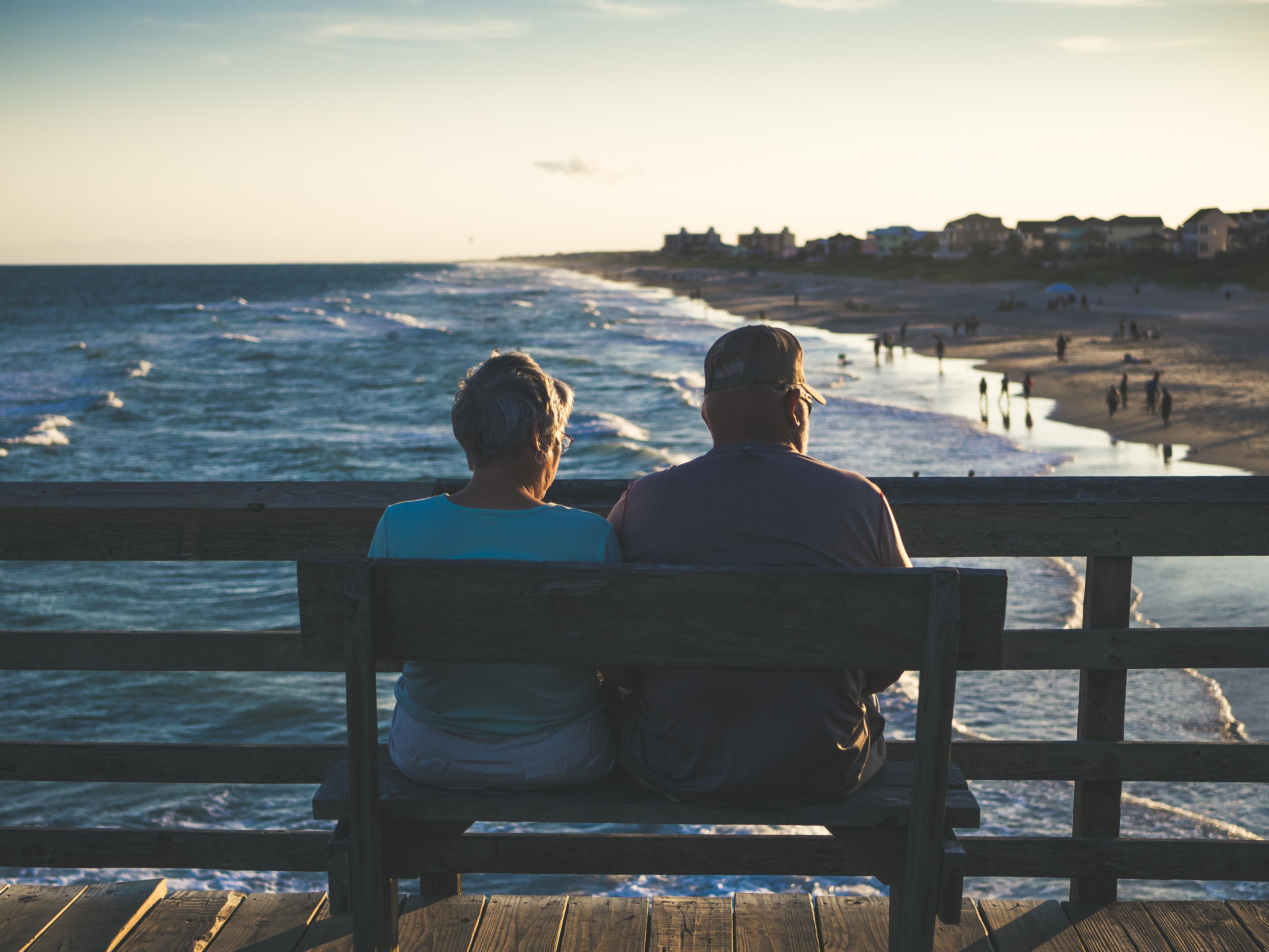 james hose jr man and woman sitting on bench